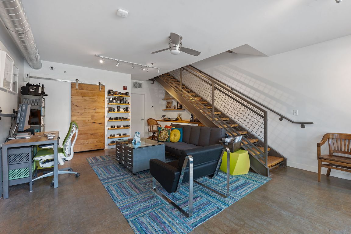 1601 East Cesar Chavez Street, Unit 104 Austin, TX 78702 - Photo 8 of 33 a living room with furniture and a wooden floor
