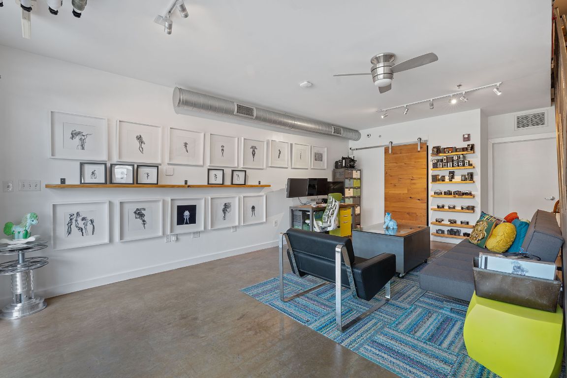 1601 East Cesar Chavez Street, Unit 104 Austin, TX 78702 - Photo 9 of 33 a living room with furniture and a rug