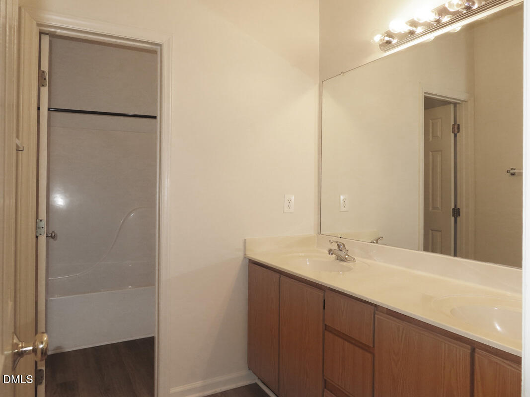 101 Rock Haven Road, Unit E500 Carrboro, NC 27510 - Photo 13 of 19 a bathroom with a sink and a mirror