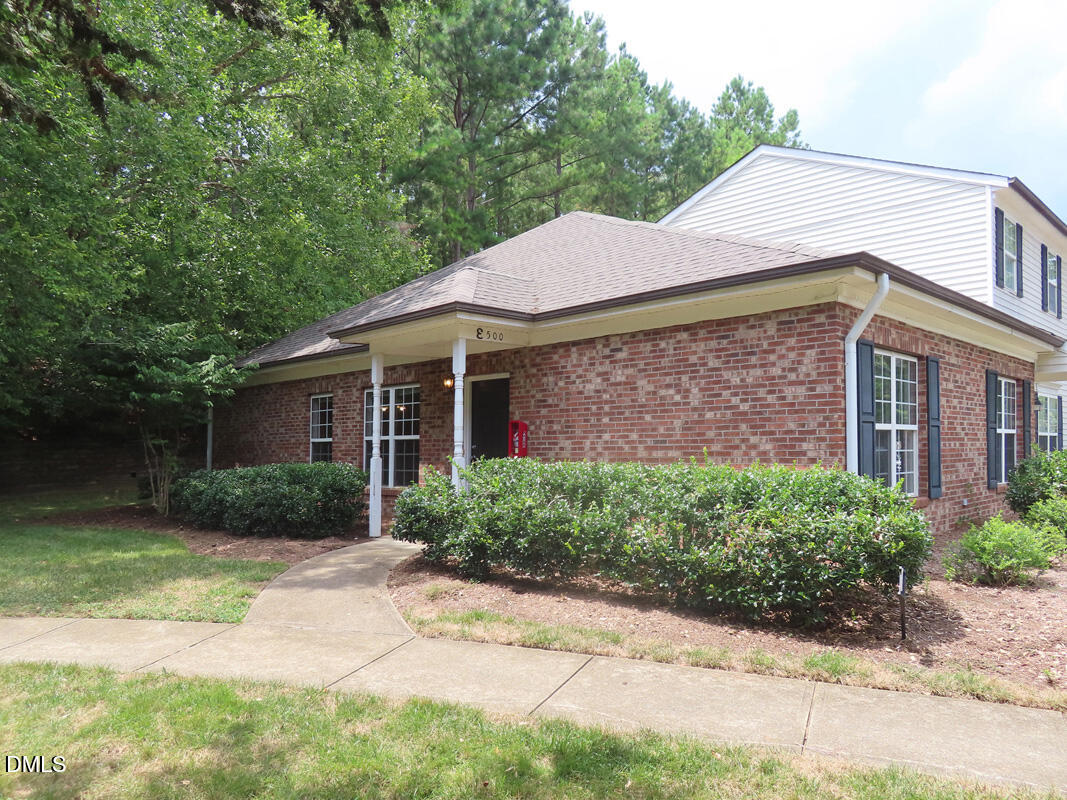 101 Rock Haven Road, Unit E500 Carrboro, NC 27510 - Photo 15 of 19 a front view of a house with garden