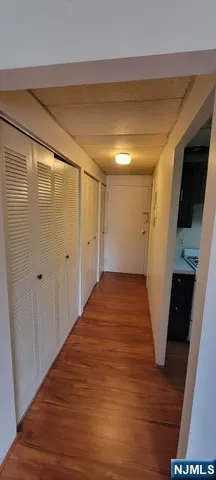 a view of a room with wooden floor and staircase