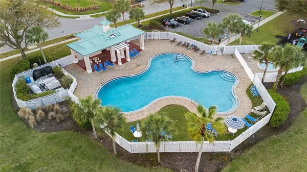 an aerial view of a house with a swimming pool