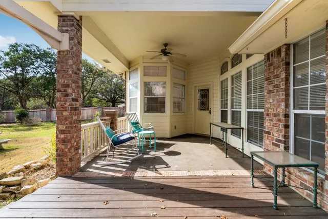 a view of a house with swimming pool and porch with furniture