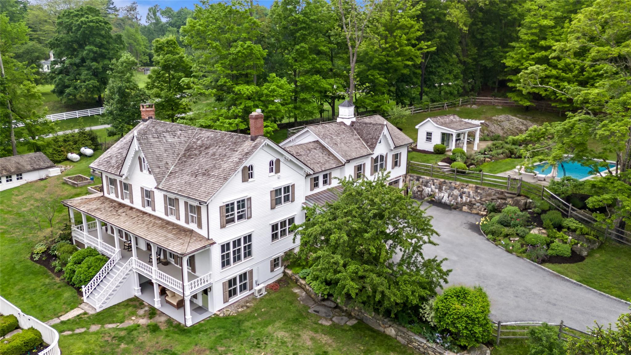 an aerial view of a house with a garden