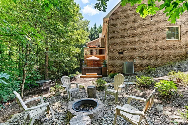 a backyard of a house with outdoor seating