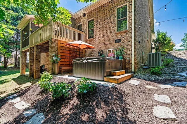a view of a patio with a table and chairs under an umbrella