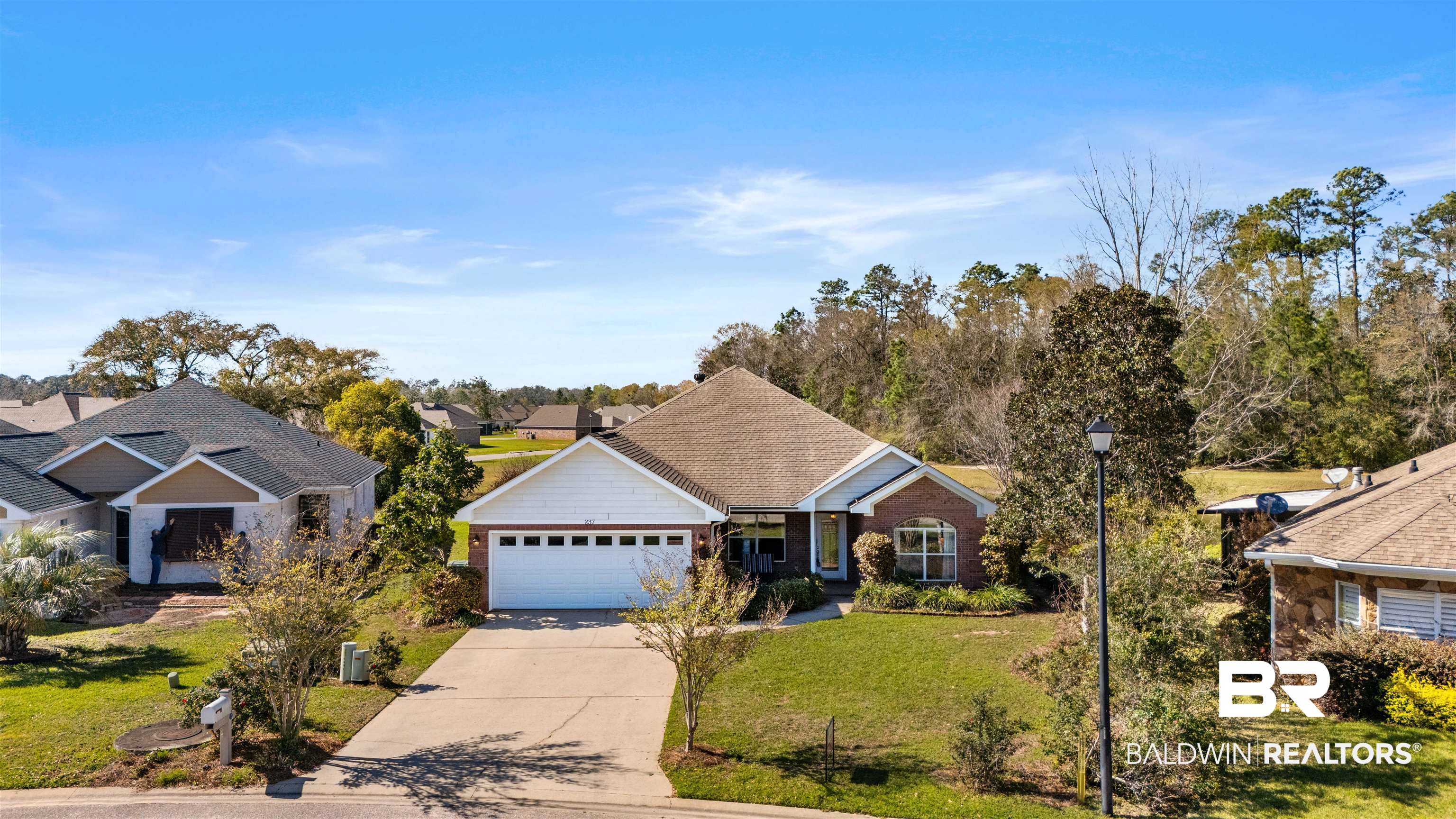 237 Hemingway Loop Foley, AL 36535 - Photo 43 of 49 View of front of house with a garage, driveway, and a front lawn