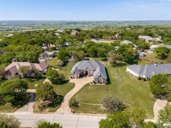 an aerial view of a house with a garden