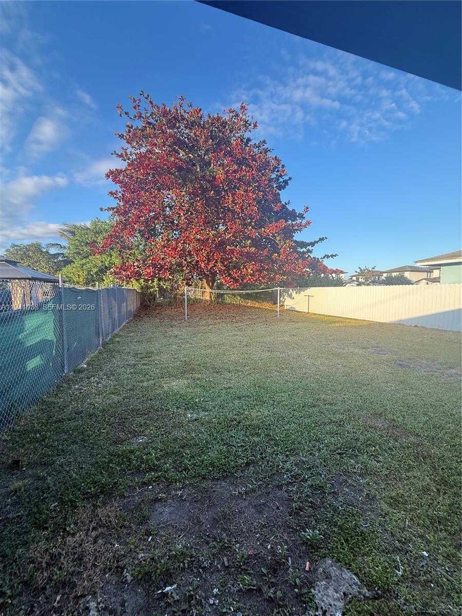 10335 Southwest 181st Street, Unit 2 Miami, FL 33157 - Photo 3 of 7 a view of an outdoor space and yard