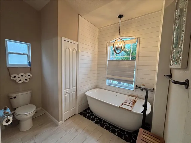 a view of a room with wooden floor and workspace