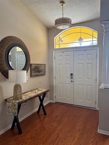 a kitchen with stainless steel appliances granite countertop a stove microwave and refrigerator