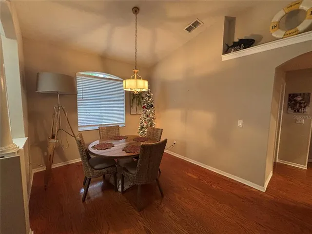 a kitchen with stainless steel appliances granite countertop a stove a refrigerator and a microwave