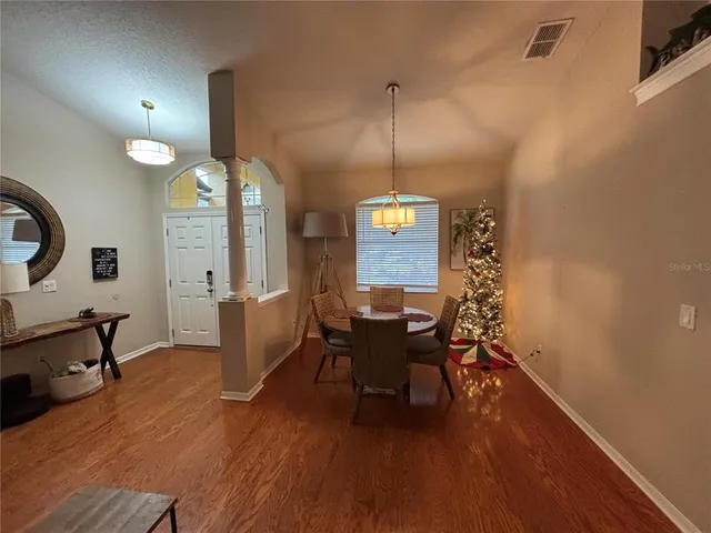 a white toilet sitting next to a bathroom sink and vanity