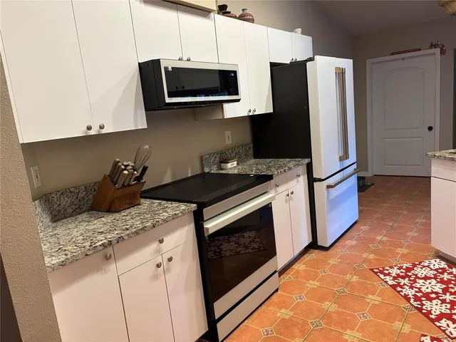 a view of entryway with window and wooden floor