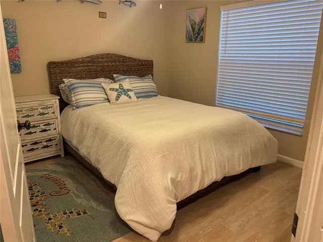 a living room with lots of furniture and windows