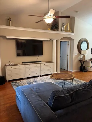 a bedroom with a bed and a mirror