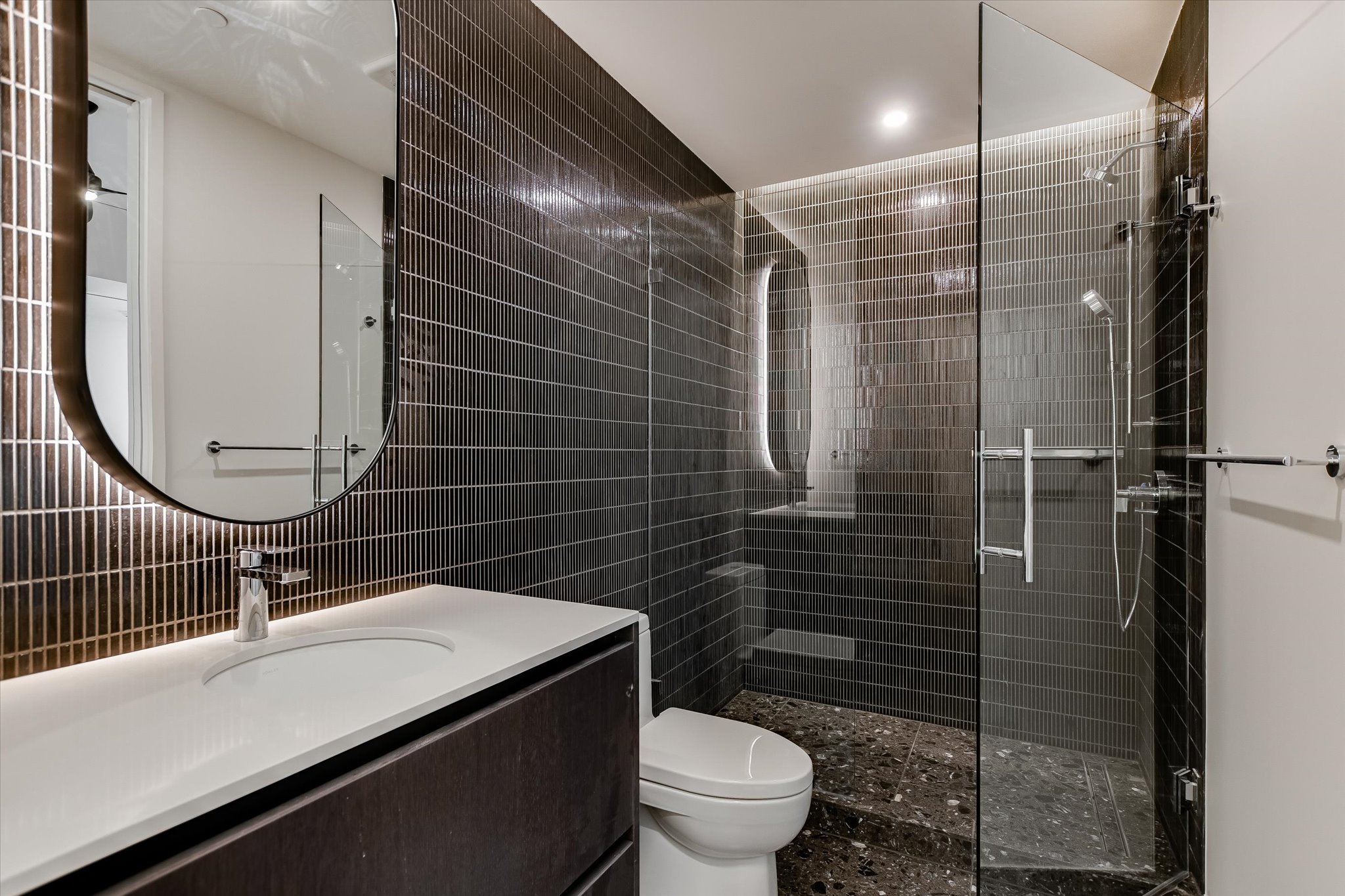 610 Davis Street, Unit 4501 Austin, TX 78701 - Photo 14 of 33 a bathroom with a sink toilet and shower