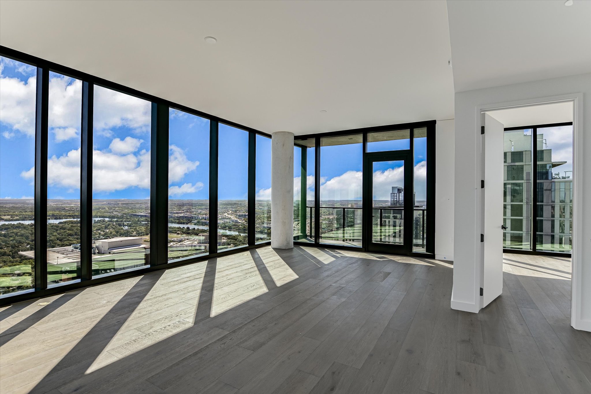 610 Davis Street, Unit 4501 Austin, TX 78701 - Photo 2 of 33 wooden floor and windows in an empty room
