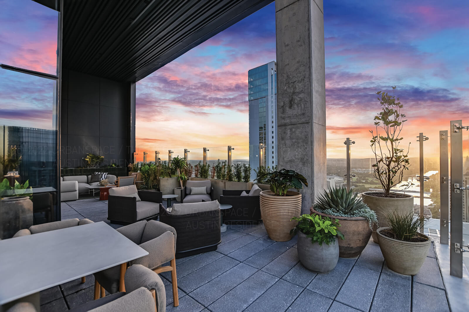 610 Davis Street, Unit 4501 Austin, TX 78701 - Photo 25 of 33 a view of a terrace with chairs and potted plants