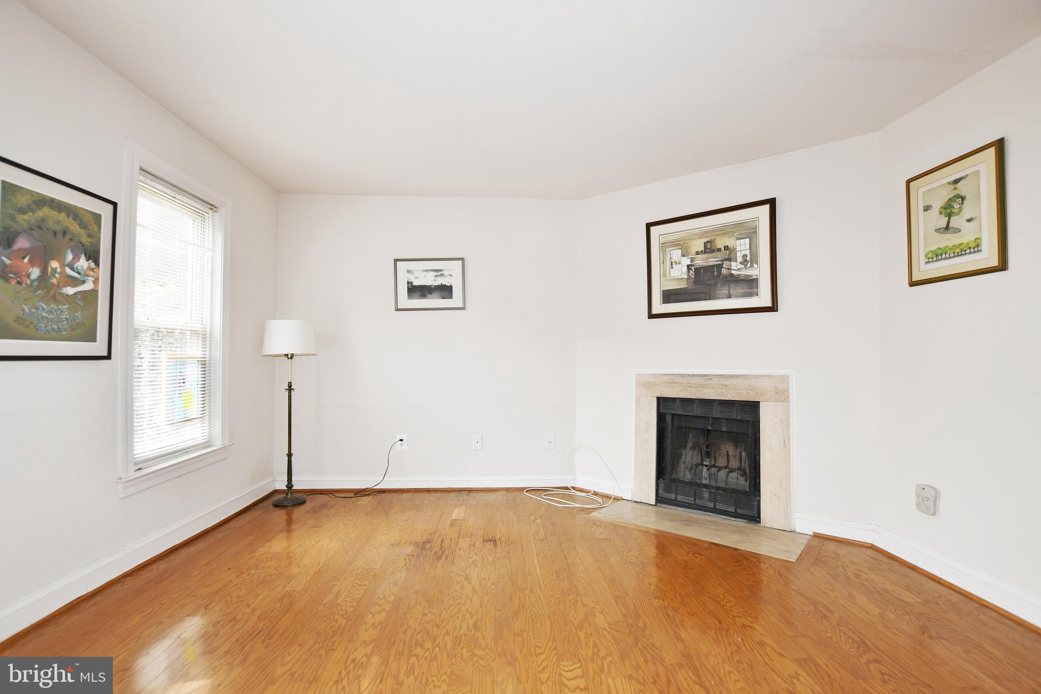 35 14th Street Northeast, Unit 35 Washington, DC 20003 - Photo 13 of 27 an empty room with windows and fireplace