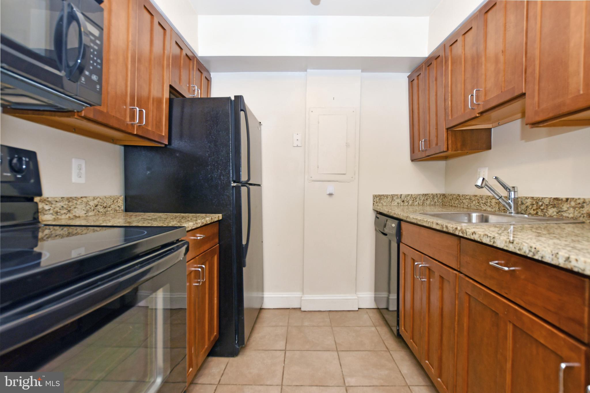 35 14th Street Northeast, Unit 35 Washington, DC 20003 - Photo 14 of 27 a kitchen with stainless steel appliances granite countertop a refrigerator and a stove