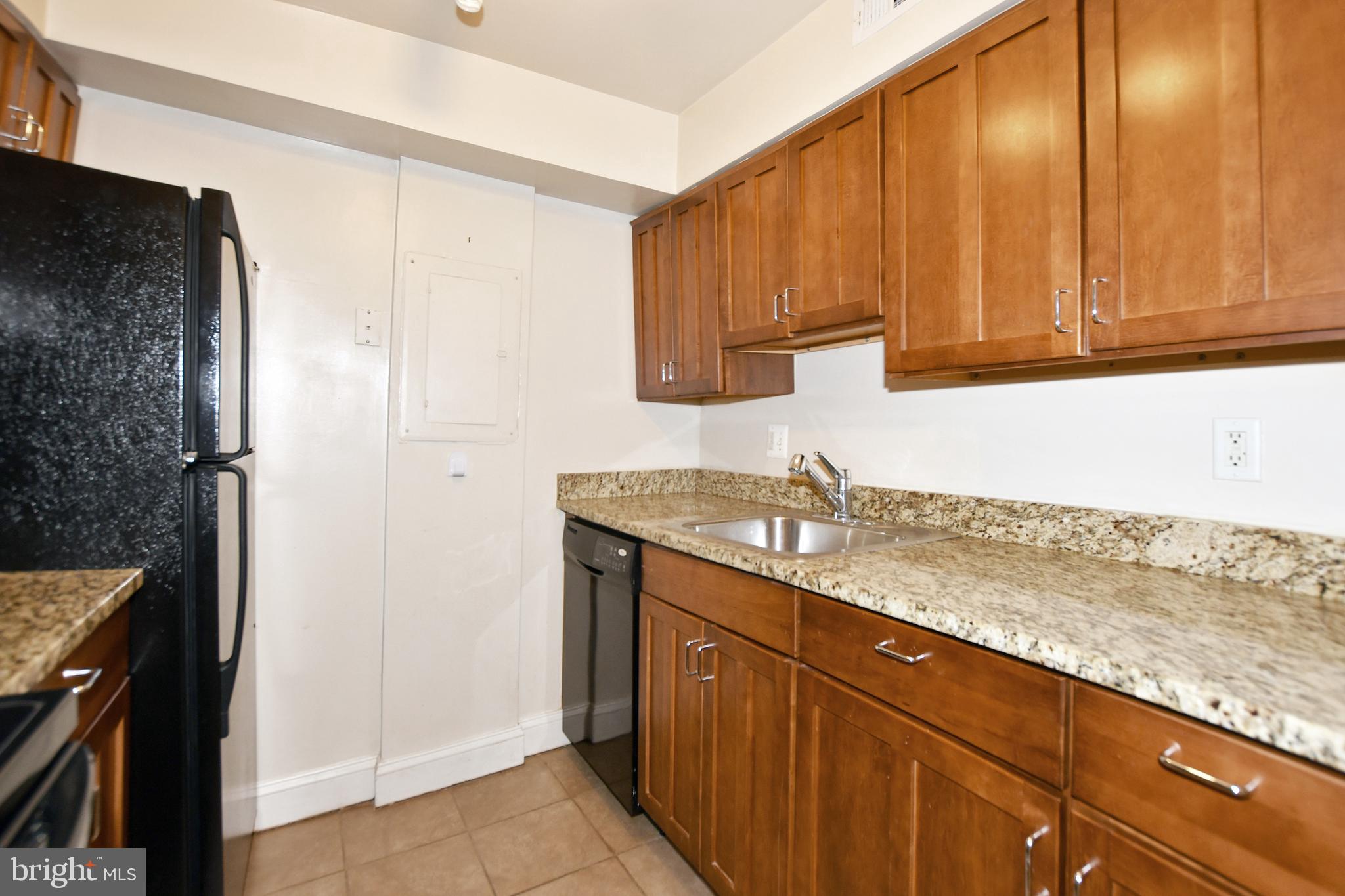 35 14th Street Northeast, Unit 35 Washington, DC 20003 - Photo 15 of 27 a kitchen with a sink and cabinets