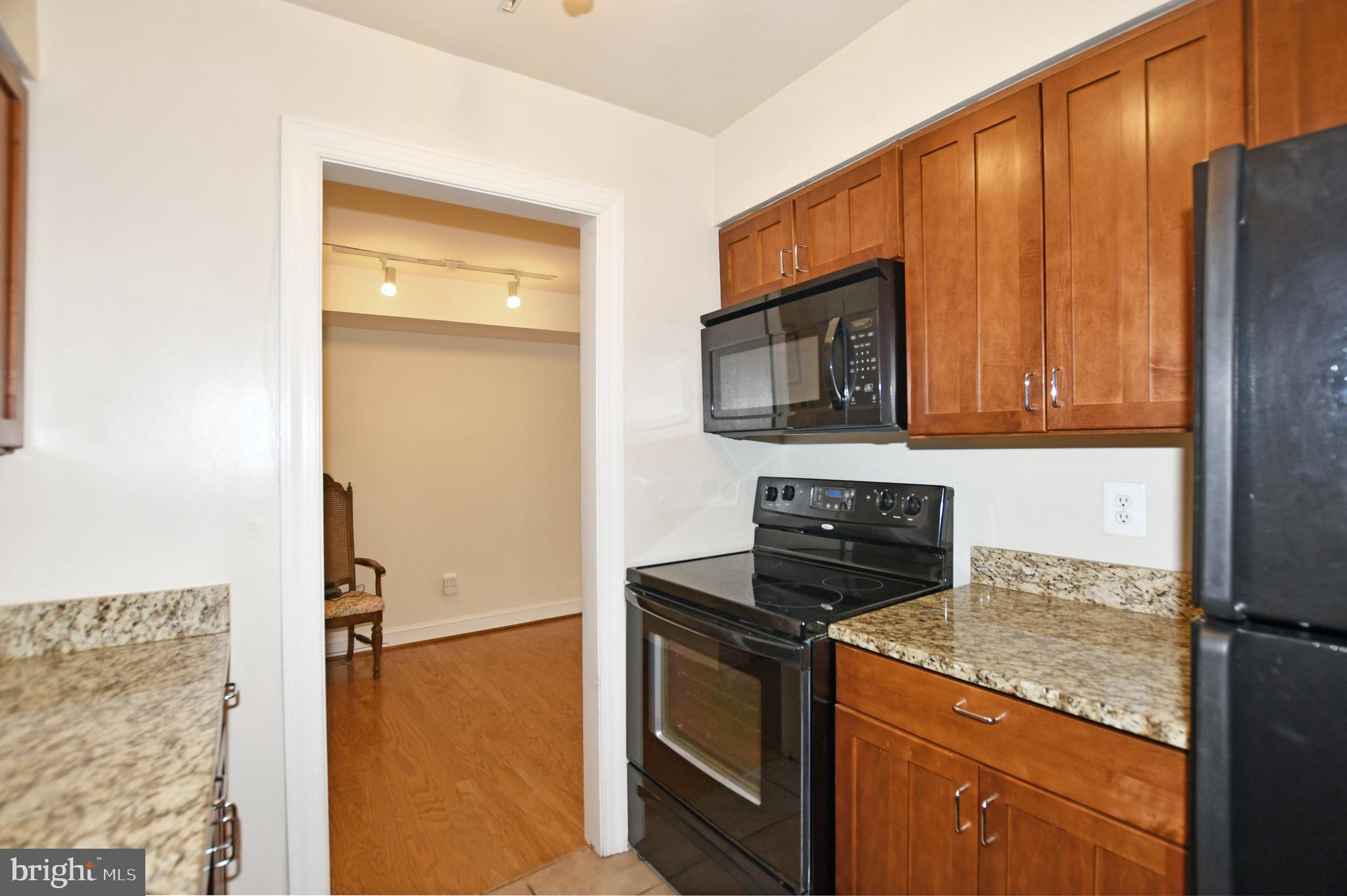 35 14th Street Northeast, Unit 35 Washington, DC 20003 - Photo 16 of 27 a kitchen with stainless steel appliances granite countertop a refrigerator stove and microwave