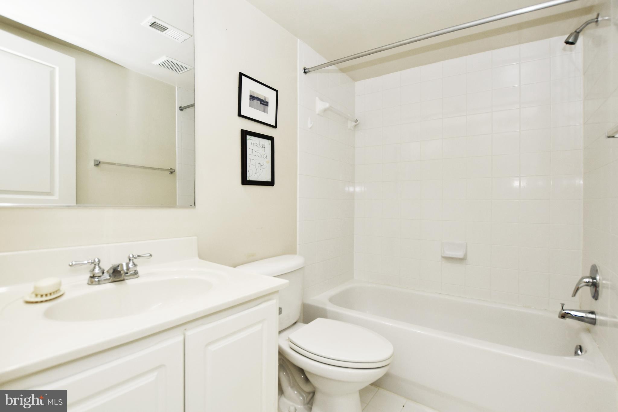 35 14th Street Northeast, Unit 35 Washington, DC 20003 - Photo 21 of 27 a bathroom with a sink toilet and shower