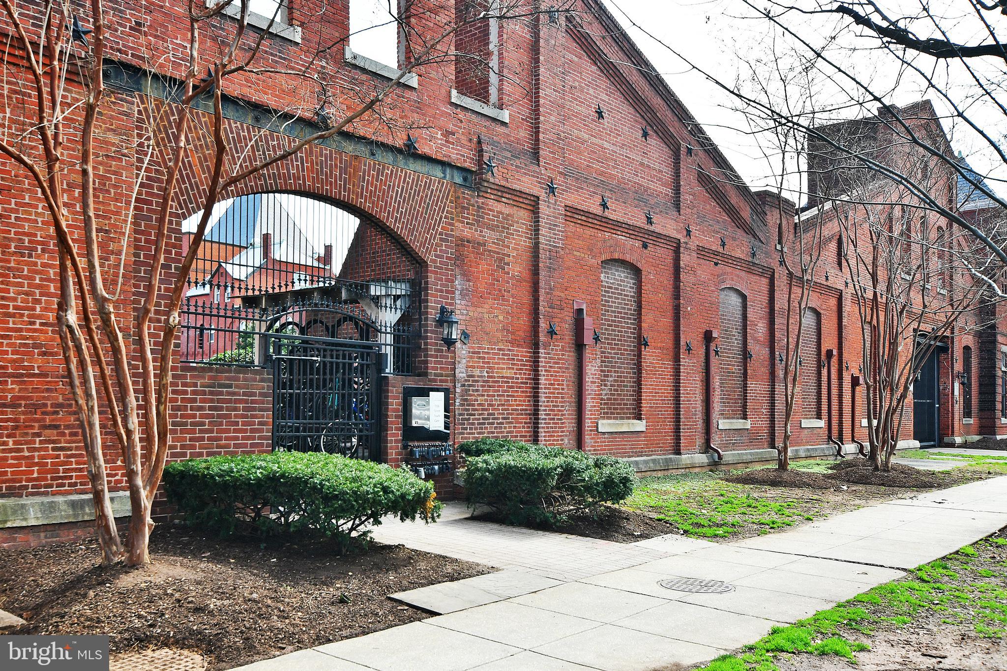 35 14th Street Northeast, Unit 35 Washington, DC 20003 - Photo 4 of 27 a view of a brick building with a yard