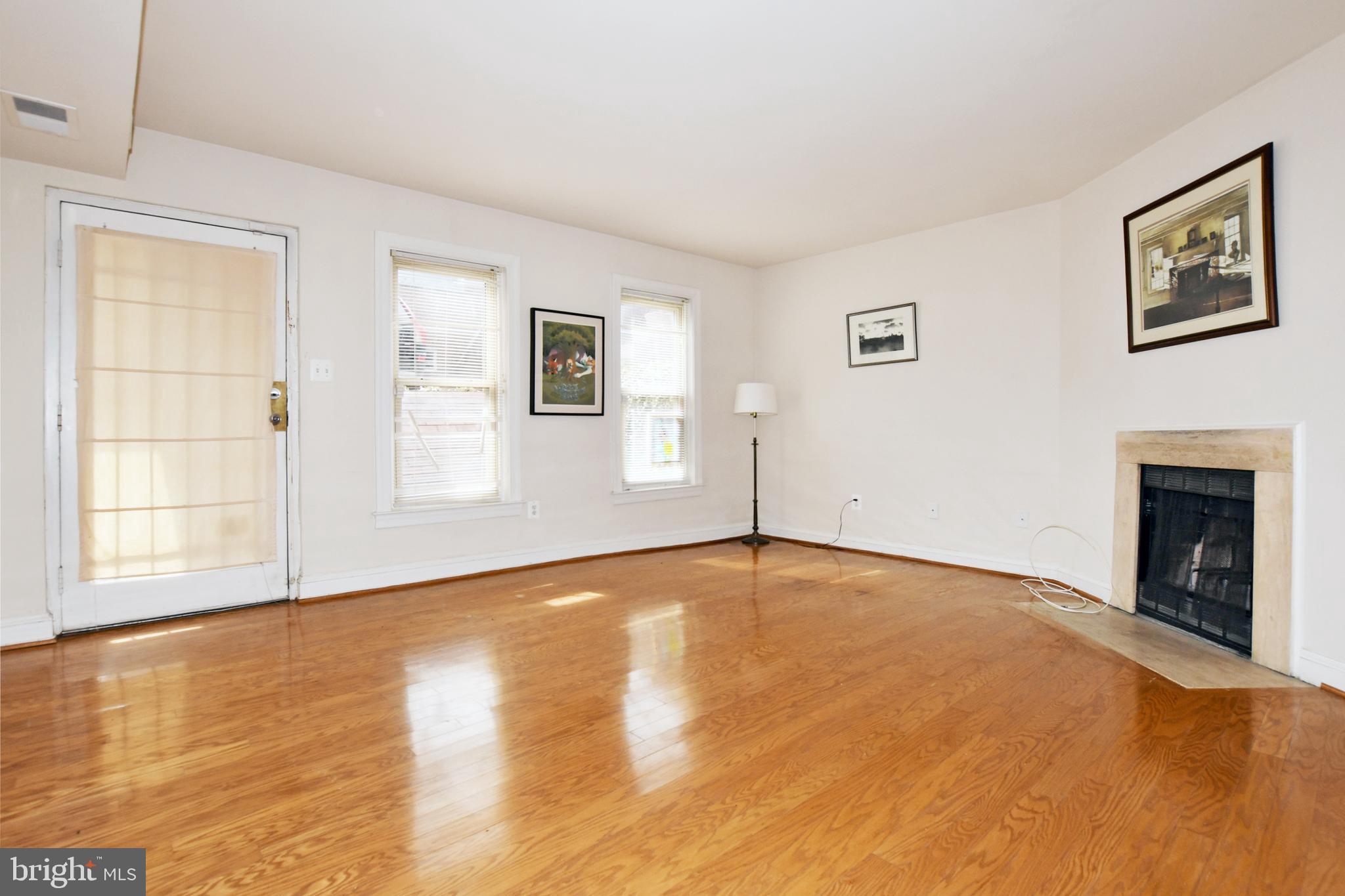 35 14th Street Northeast, Unit 35 Washington, DC 20003 - Photo 10 of 27 a view of an empty room with window and wooden floor