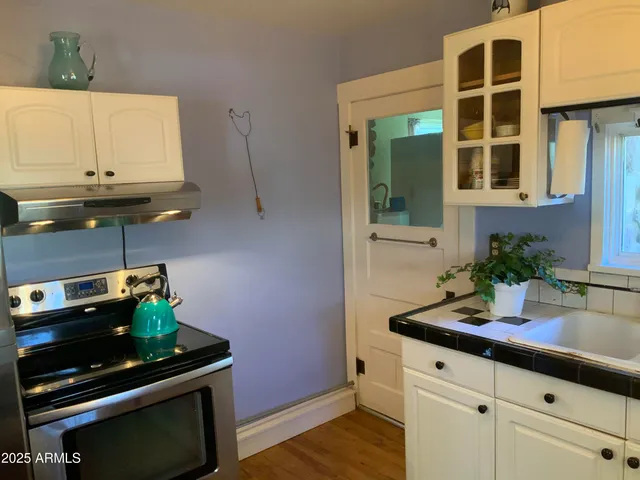 a kitchen with a sink and cabinets