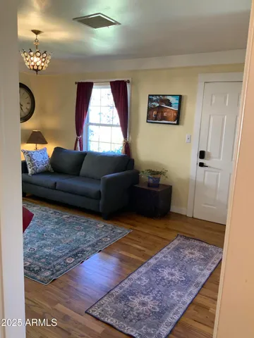 a living room with furniture and a rug