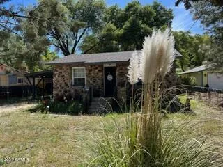 a view of house with trees in front of it