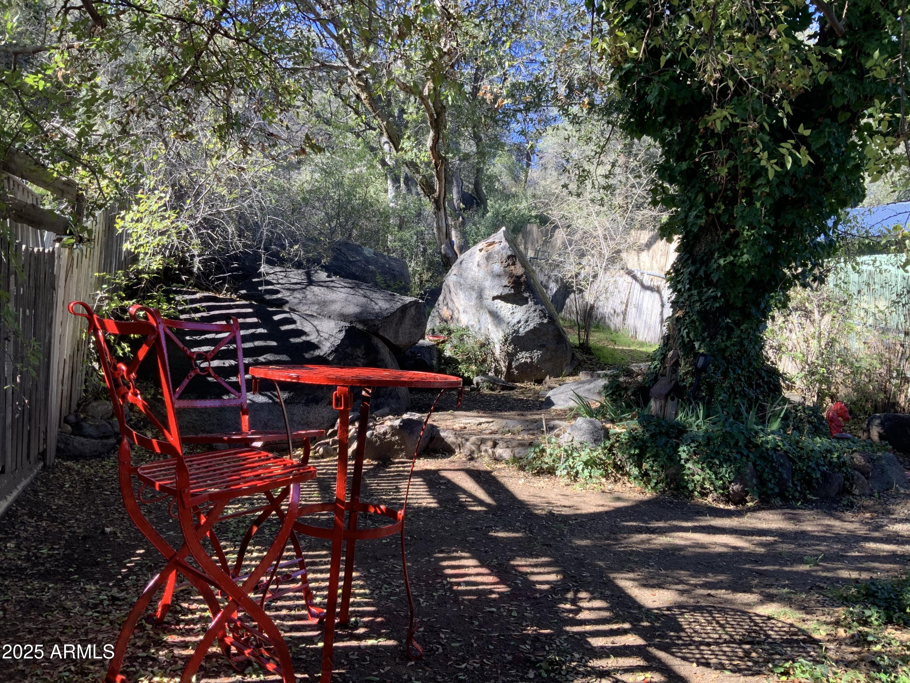 16775 Shrine Drive Yarnell, AZ 85362 - Photo 35 of 46 a view of a patio with table and chairs under an umbrella