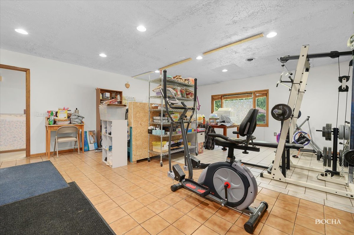 38 Pembrooke Road Montgomery, IL 60538 - Photo 14 of 16 a view of a room with gym equipment