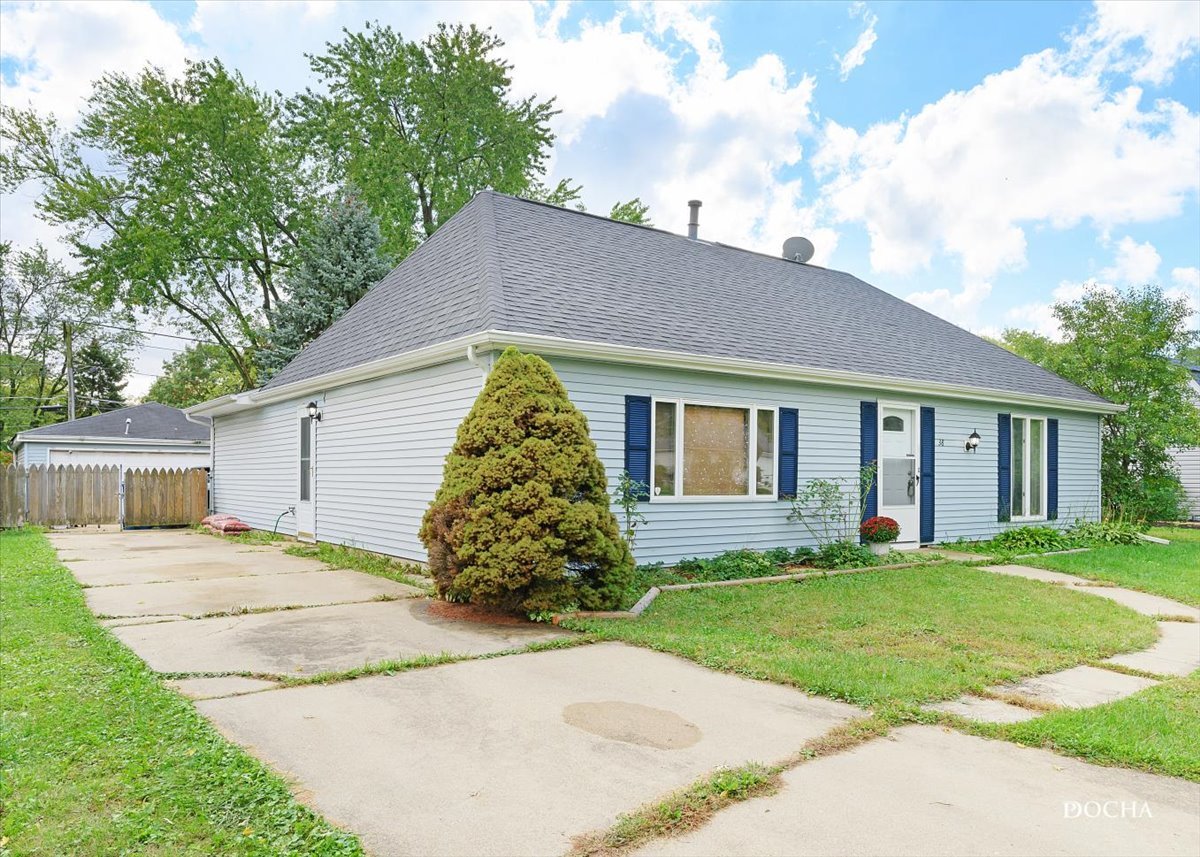 38 Pembrooke Road Montgomery, IL 60538 - Photo 15 of 16 a front view of a house with a yard and trees