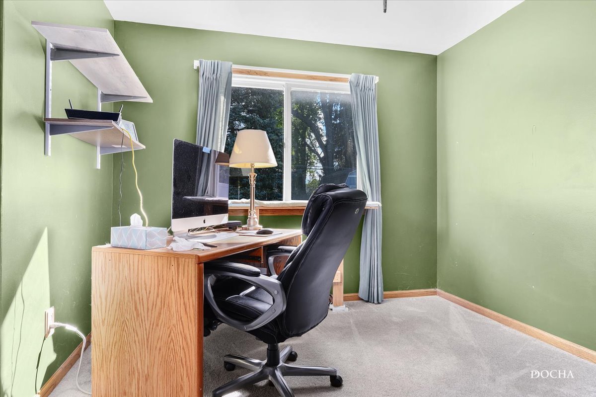 38 Pembrooke Road Montgomery, IL 60538 - Photo 7 of 16 a view of a workspace with furniture and a window