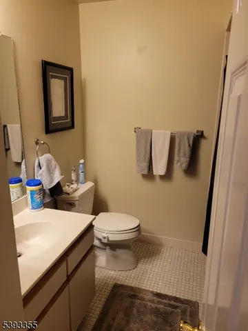 a bathroom with a sink toilet and mirror