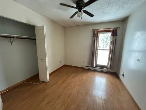 a bathroom with a shower and a toilet