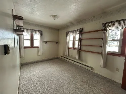 a view of room window and ceiling fan