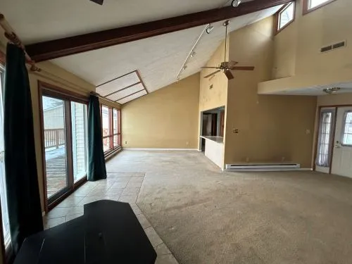 a kitchen with stainless steel appliances granite countertop a sink stove and microwave