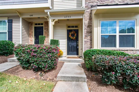 a view of a pathway front of house and a front door