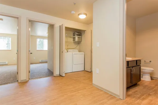 a view of a bathroom with toilet shower and a sink