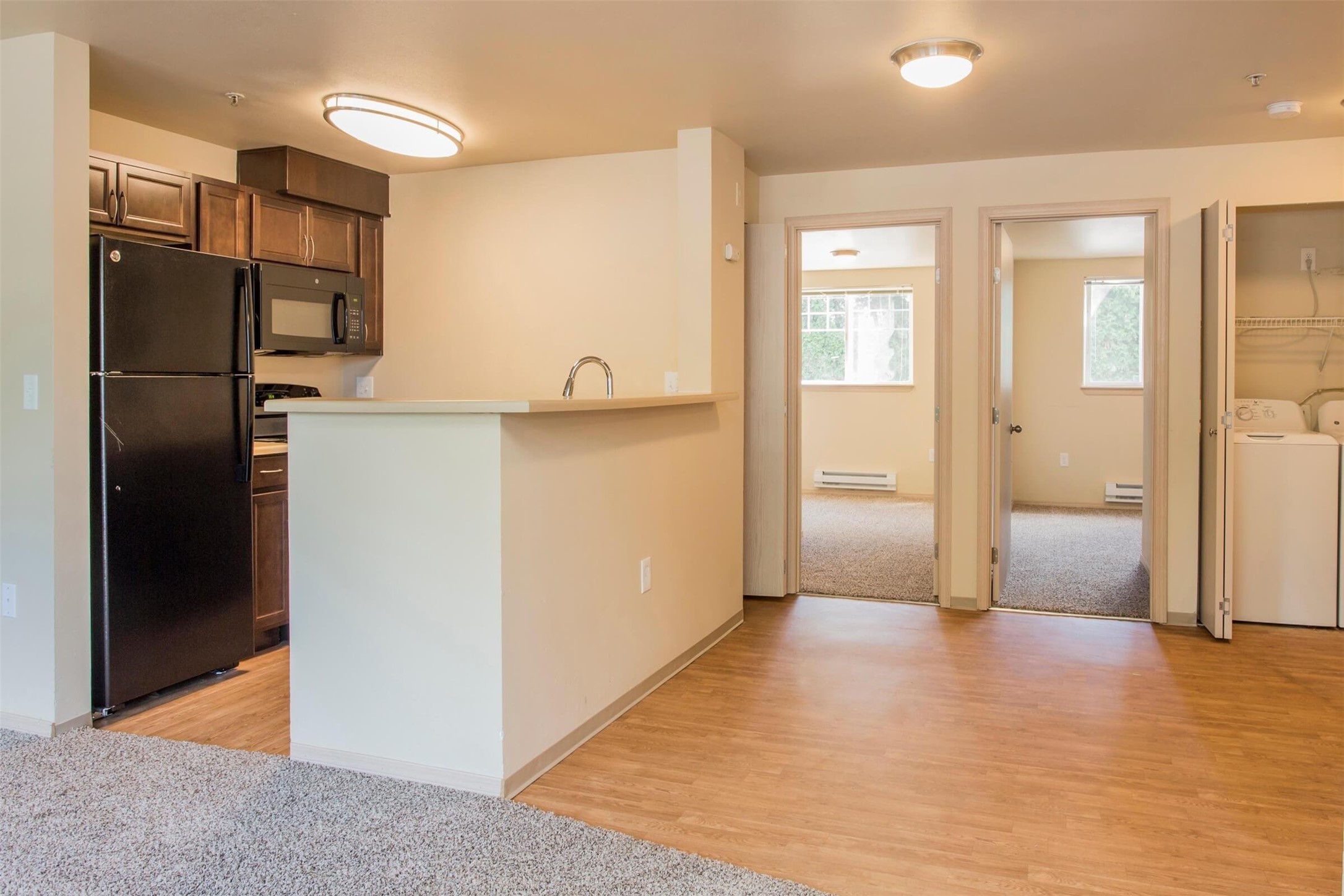 1406 Maple Lane Kent, WA 98030 - Photo 12 of 17 a view of a kitchen with a refrigerator and a sink