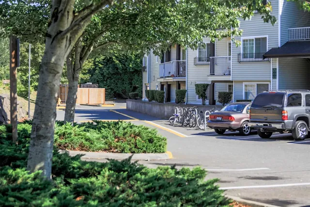 a car parked in front of a brick house