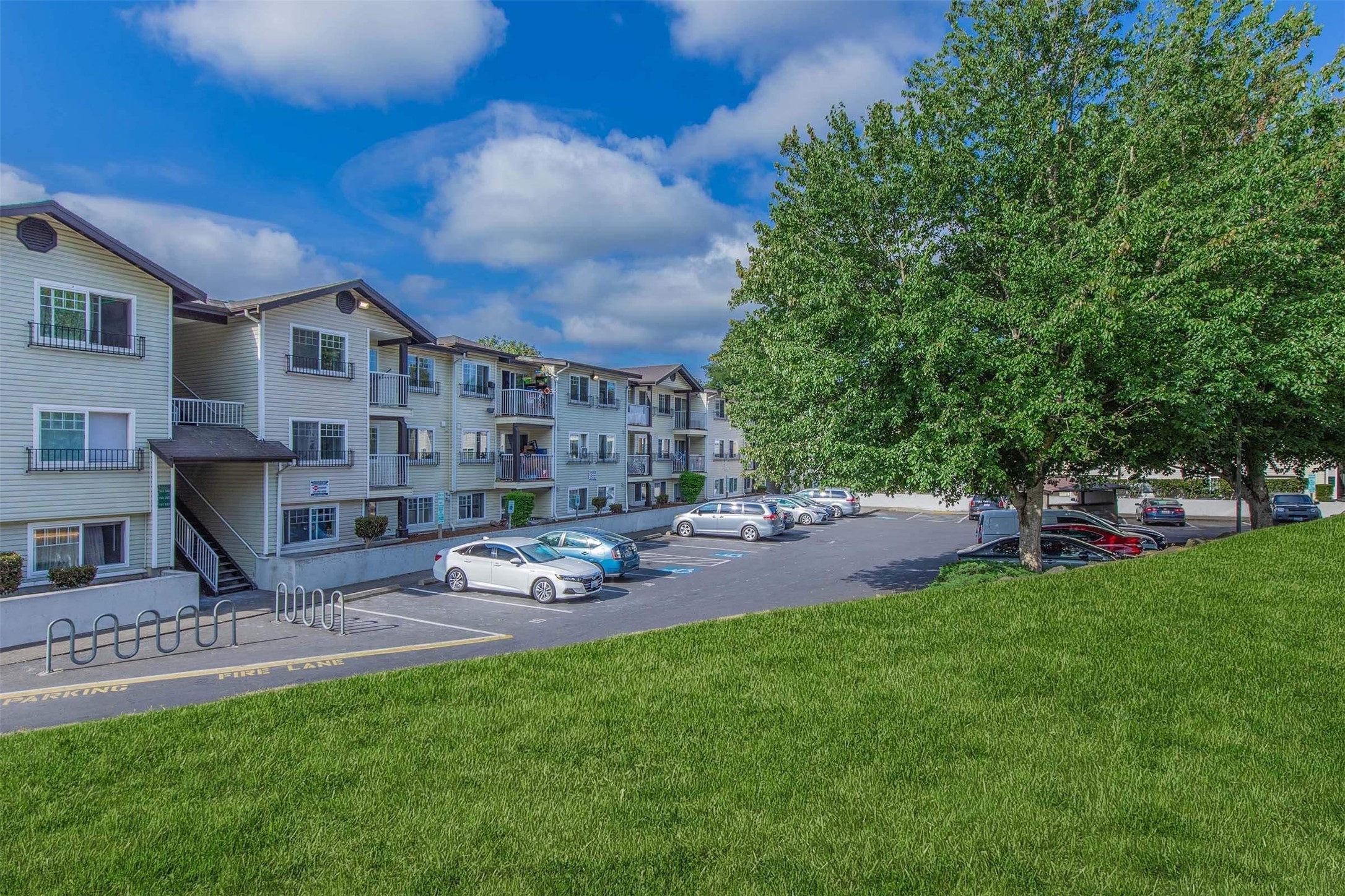 1406 Maple Lane Kent, WA 98030 - Photo 7 of 17 a backyard of a house with table and chairs