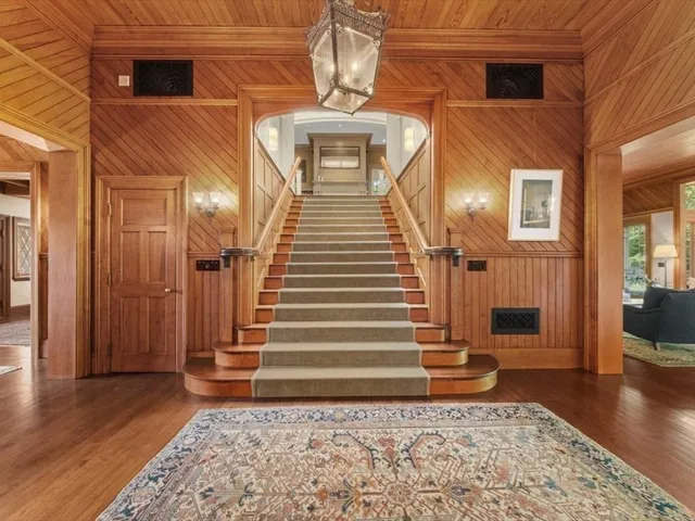 a view of a entryway of a house with wooden floor