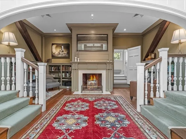 a living room with a rug