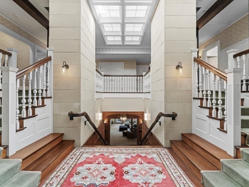 159 Bridge Street Manchester, MA 01944 - Photo 20 of 42 a living room with furniture a rug and a fireplace