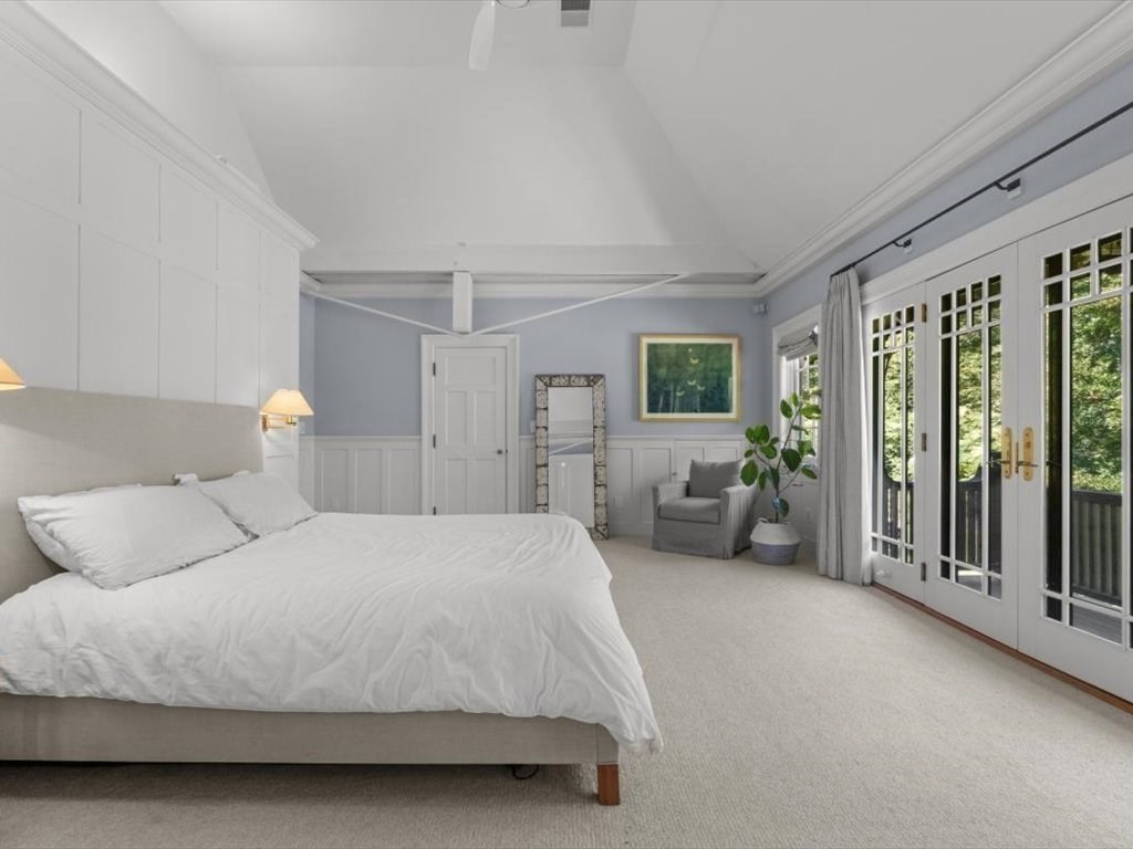 159 Bridge Street Manchester, MA 01944 - Photo 22 of 42 a spacious bedroom with a bed and large windows